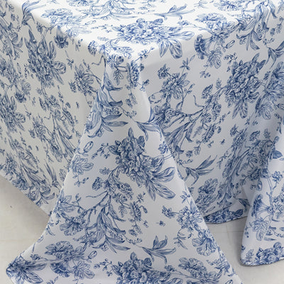 Blue floral-patterned tablecloth on a white background.