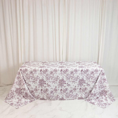 Floral pink tablecloth on rectangular table with cream curtains background