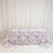 Floral pink tablecloth on rectangular table with cream curtains background