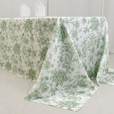 Green floral tablecloth draped elegantly over a table.