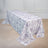 Floral tablecloth on a table with elegant design and soft colors.