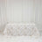 Floral tablecloth on table against white curtain backdrop