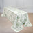 Floral tablecloth draped over a table in an elegant setting.