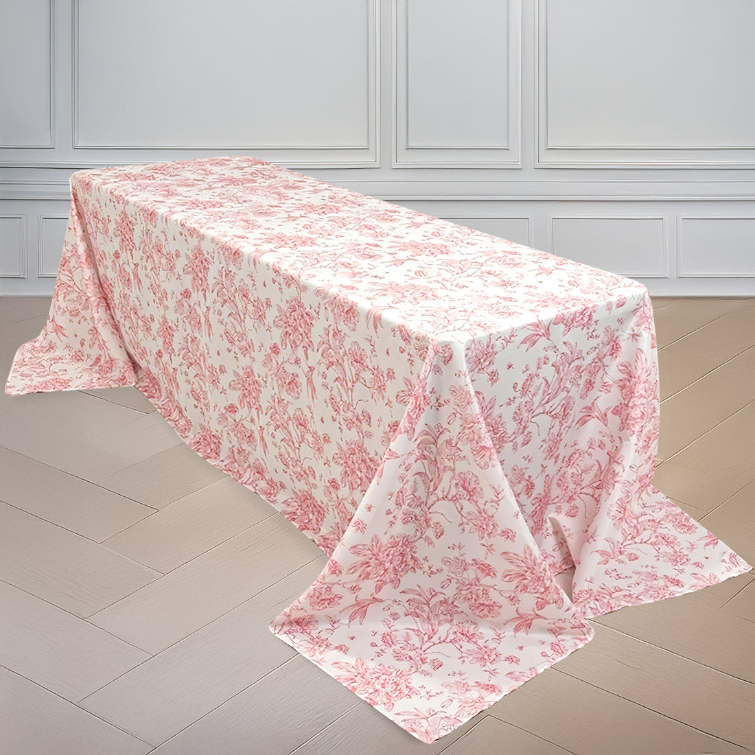 Floral-patterned tablecloth draped over a table in a bright setting.