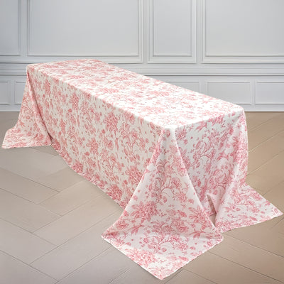 Floral-patterned tablecloth draped over a table in a bright setting.