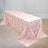 Floral-patterned tablecloth draped over a table in a bright setting.