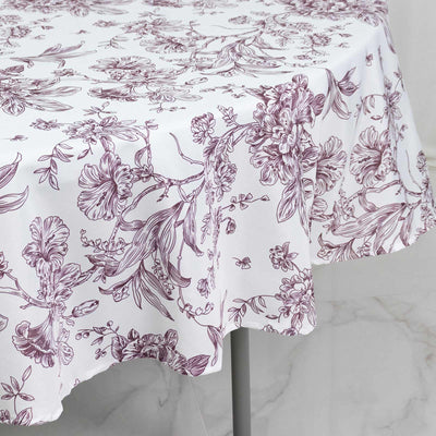 White floral tablecloth with burgundy botanical print on dining table