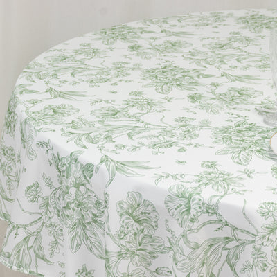 Floral-patterned round tablecloth in green and white.