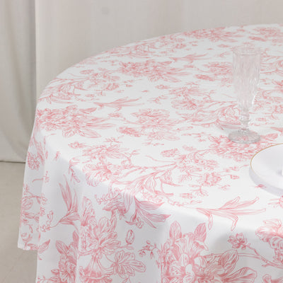 Floral-patterned tablecloth draped over a round table.