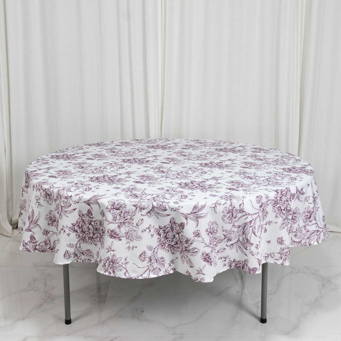 Round floral tablecloth on dining table, white with purple botanical print