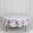 Round floral tablecloth on dining table, white with purple botanical print