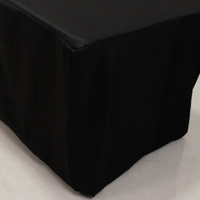 Black tablecloth draped over a table for events and gatherings.