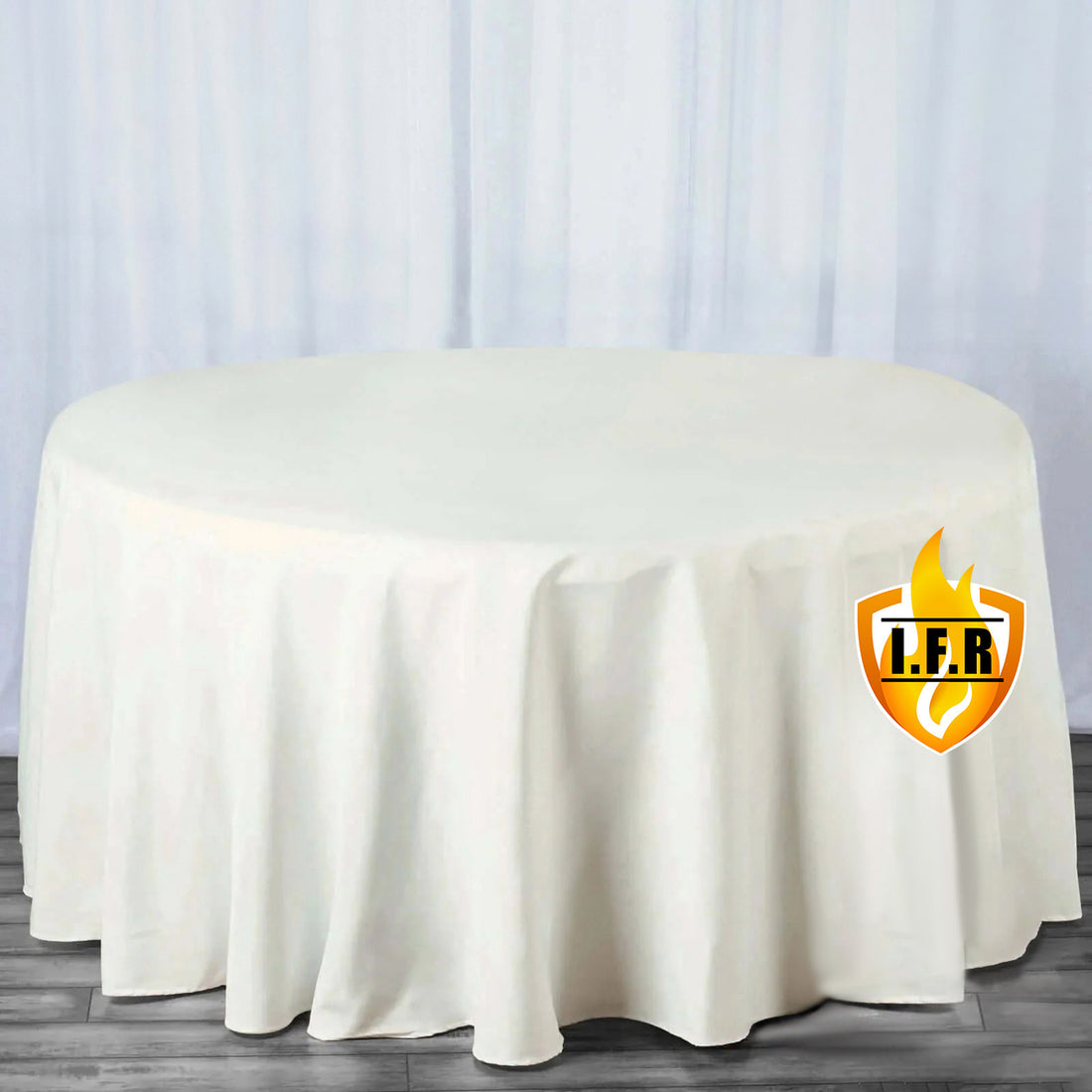 White round tablecloth draped over a table with a smooth finish.