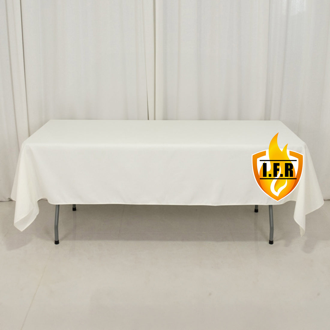 White table with a logo on the front, featuring a plain backdrop.