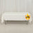 White table with a logo on the front, featuring a plain backdrop.