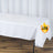 White tablecloth draped over a table with L.F.R. logo
