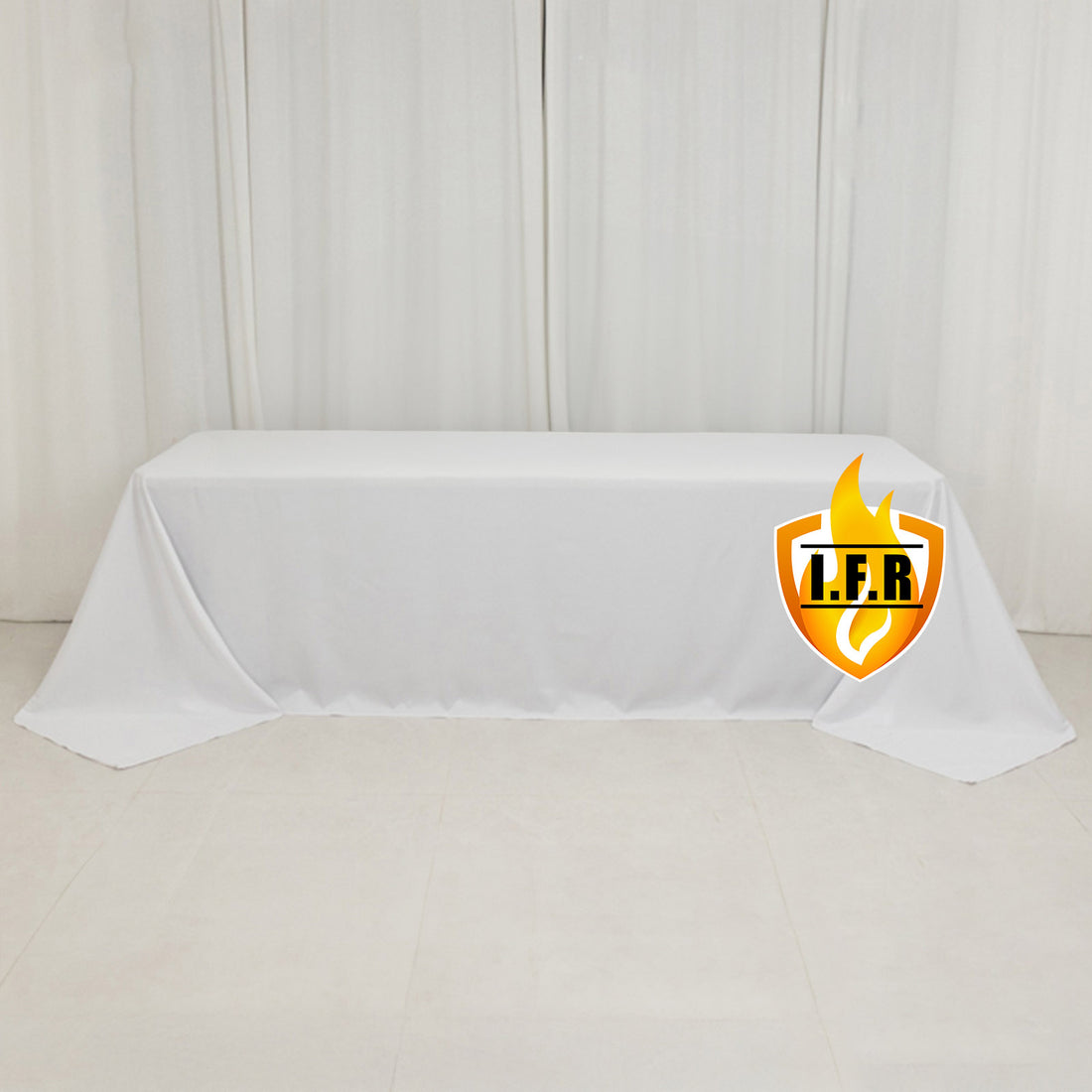 White table cover with logo on a plain backdrop