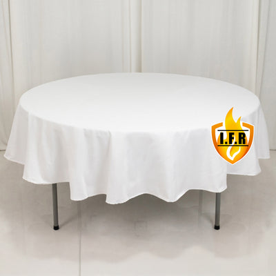 Round white tablecloth on a table with a logo.