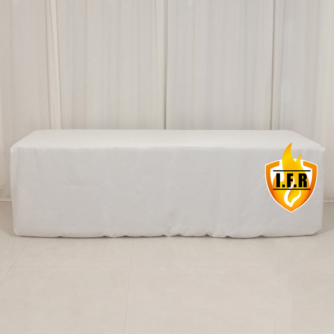 White table cover with logo on a plain backdrop