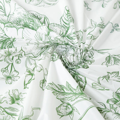 Green floral patterned fabric draped elegantly.