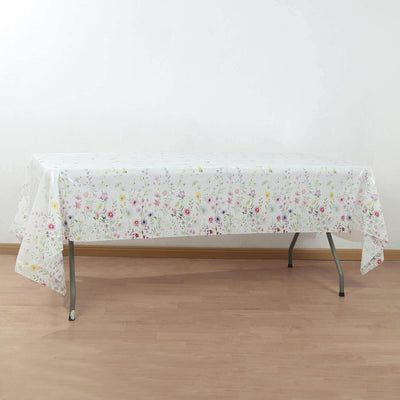 Floral-patterned tablecloth draped over a folding table