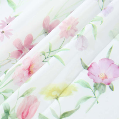 Floral patterned sheer fabric with pink and yellow flowers.