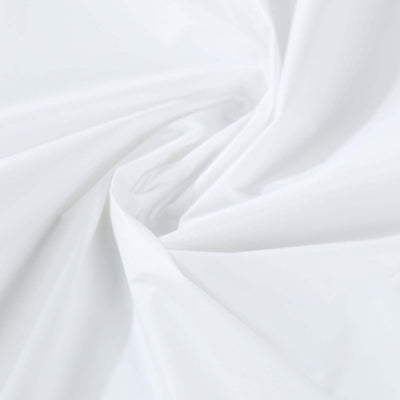 White fabric texture with soft draping folds.