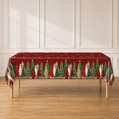 Christmas tree tablecloth on dining table in bright room