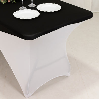 Black and white table cover with elegant draping for events or dining.
