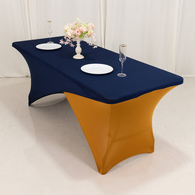 Elegant navy and gold tablecloth draped over a banquet table with floral centerpiece.