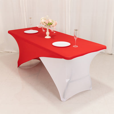 Red and white table cover with decorative centerpiece for events or parties.