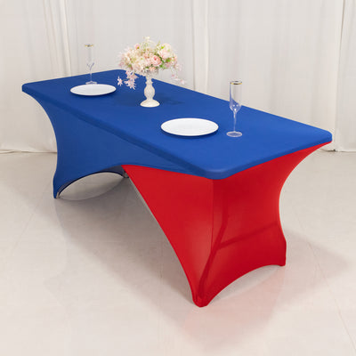 Blue and red table cover on a table with plates and glasses.