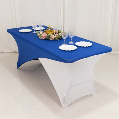 Blue and white table with plates and glasses set for dining.