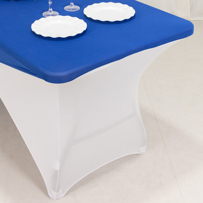 Blue table cover on a white table with decorative plates.