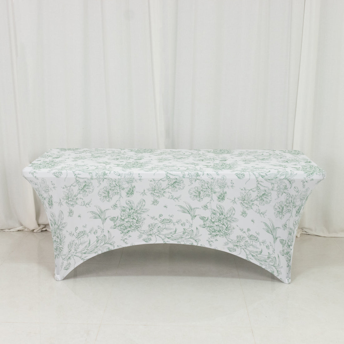 Floral print table cover on a table in a studio setting