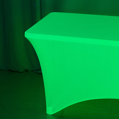Green illuminated table with a sleek design.