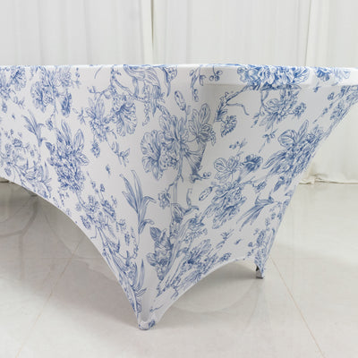 Floral tablecloth in blue and white on a plain surface.