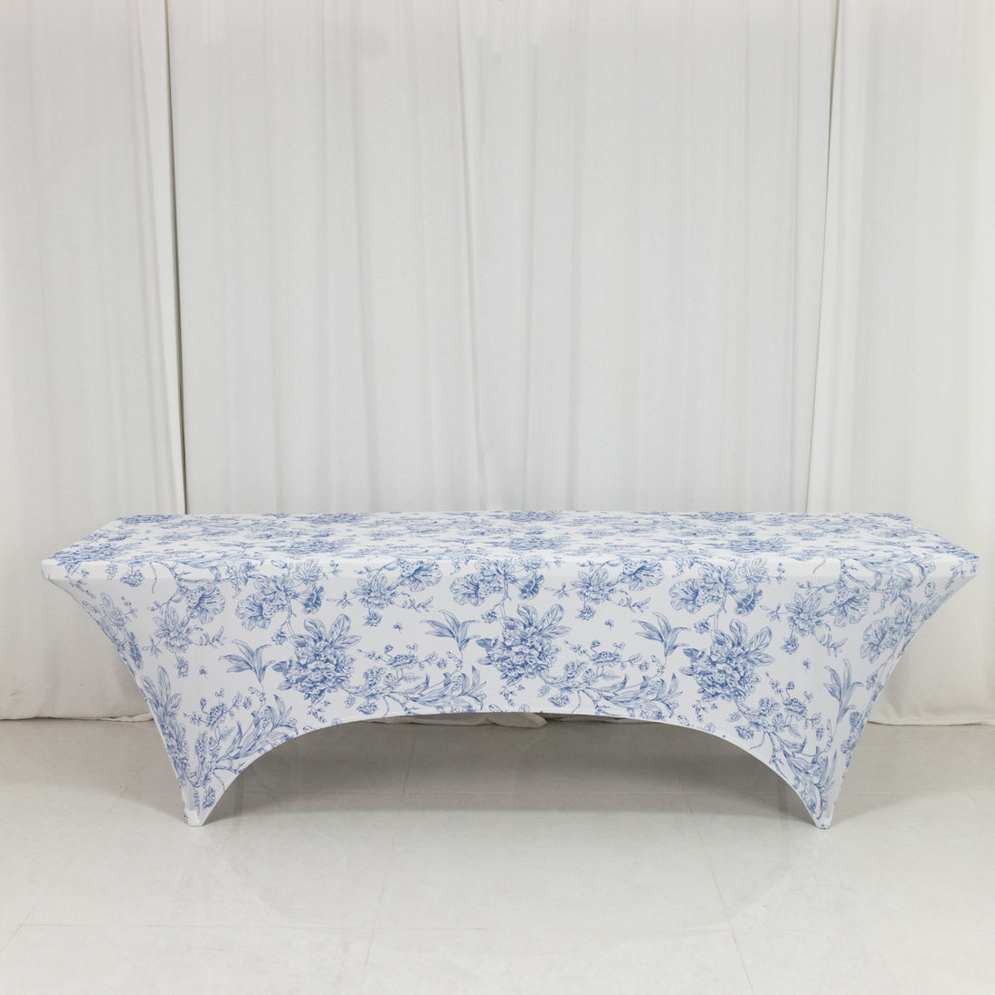 Floral print table cover on a plain backdrop