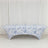 Floral print table cover on a plain backdrop