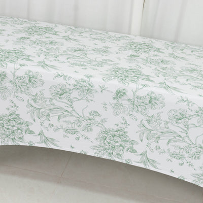 Floral patterned tablecloth with green and white design.