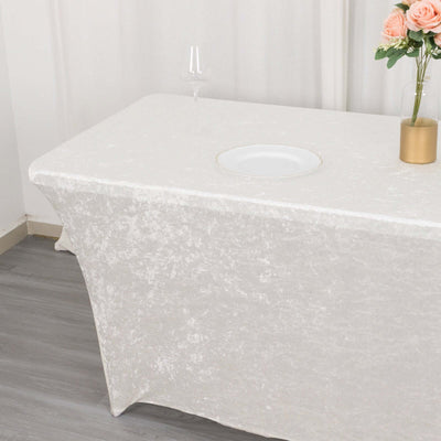 Elegant white tablecloth draped over a table with a decorative centerpiece.