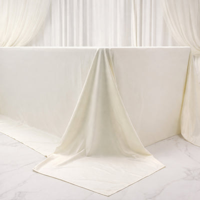 White satin tablecloth draped elegantly over a table.
