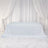 White tablecloth draped over a table, set against a soft, elegant backdrop.