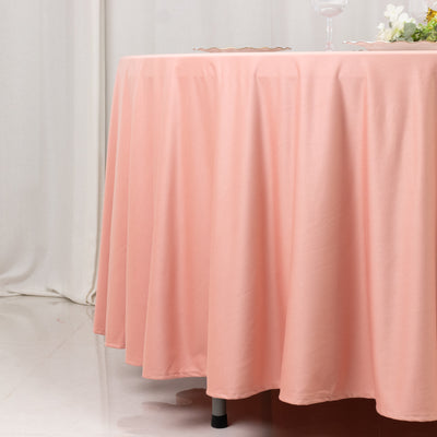 Peach tablecloth draping elegantly over a round table