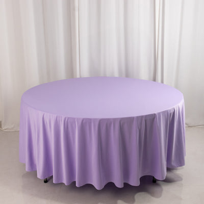Round purple tablecloth on a circular table.