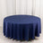 Round navy tablecloth with draped edges on a plain backdrop.