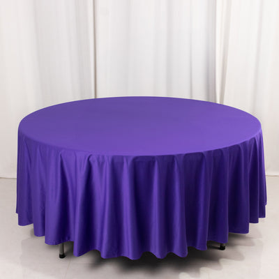Purple round tablecloth on a circular table, showcasing smooth fabric draping.