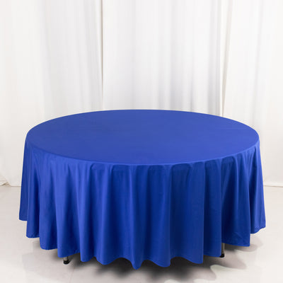 Round blue tablecloth on a white backdrop.