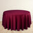 Burgundy round tablecloth draped elegantly over a table