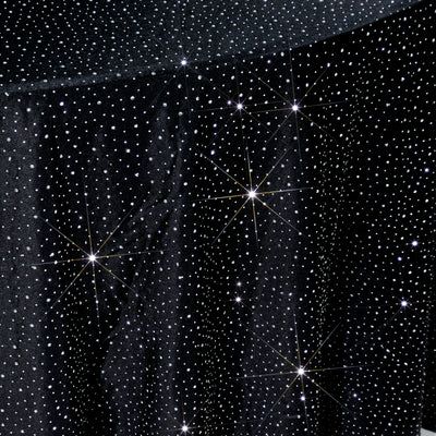 Sparkling black fabric with star-like embellishments